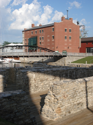 The reconstructed Commercial Slip and bridge, historic building ruins, interpretive elements, museum, and park